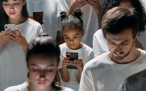 People using cell phones for finances or Bitcoin's golden coin